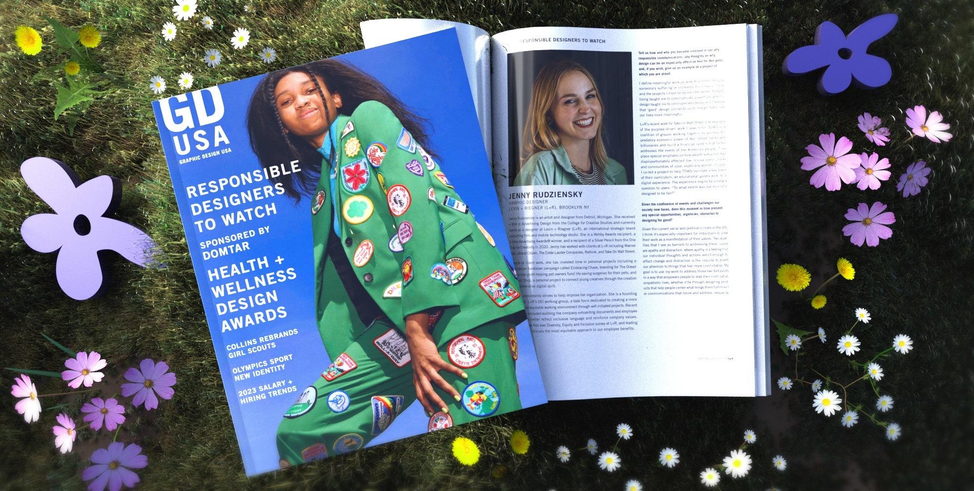GDUSA 'Responsible Designers to Watch' issue open to Jenny Rudziensky's profile, on grass with flowers.