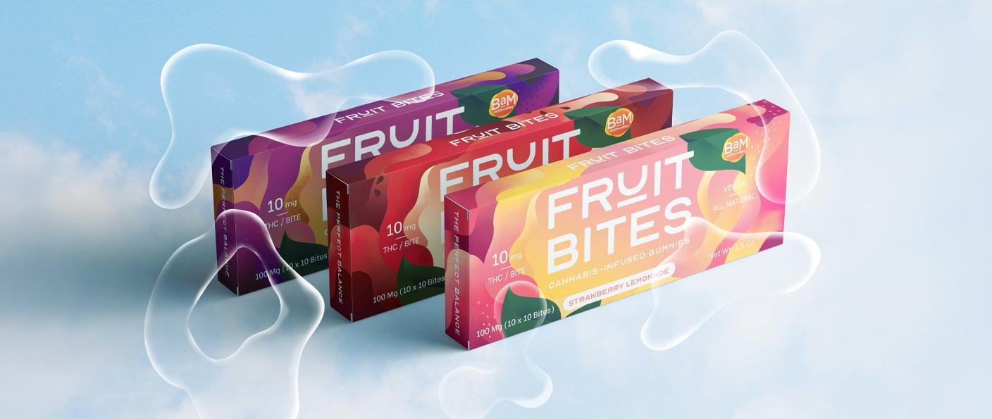 Colorful "Fruit Bites" cannabis-infused gummy boxes floating against a sky background