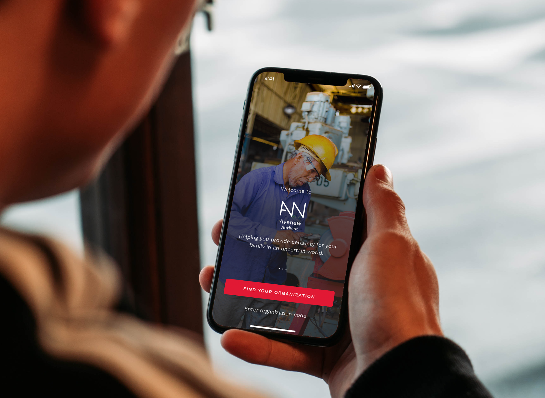 Person holding a phone showing the Avenue app welcome screen