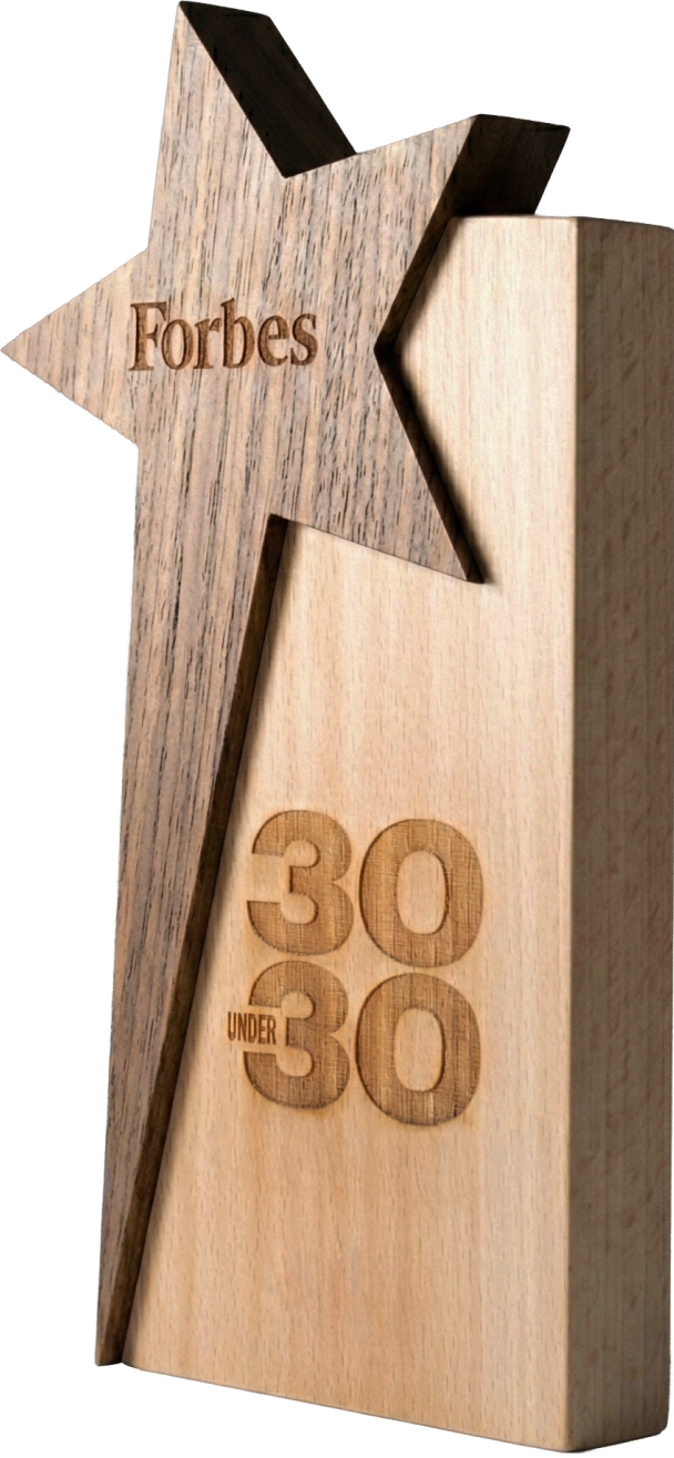 Wooden Forbes 30 Under 30 award with star-shaped top