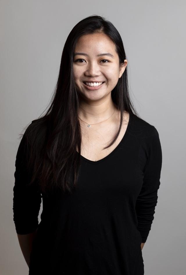 Portrait of Grace Kim, L+R Brooklyn strategy intern, against a gray studio backdrop