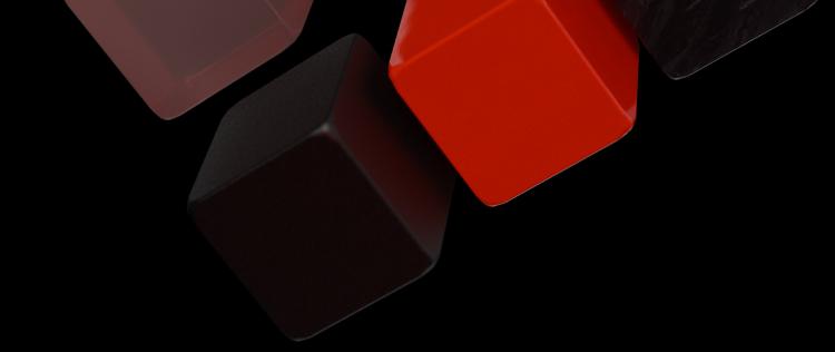 Red and black cubes floating against a black background