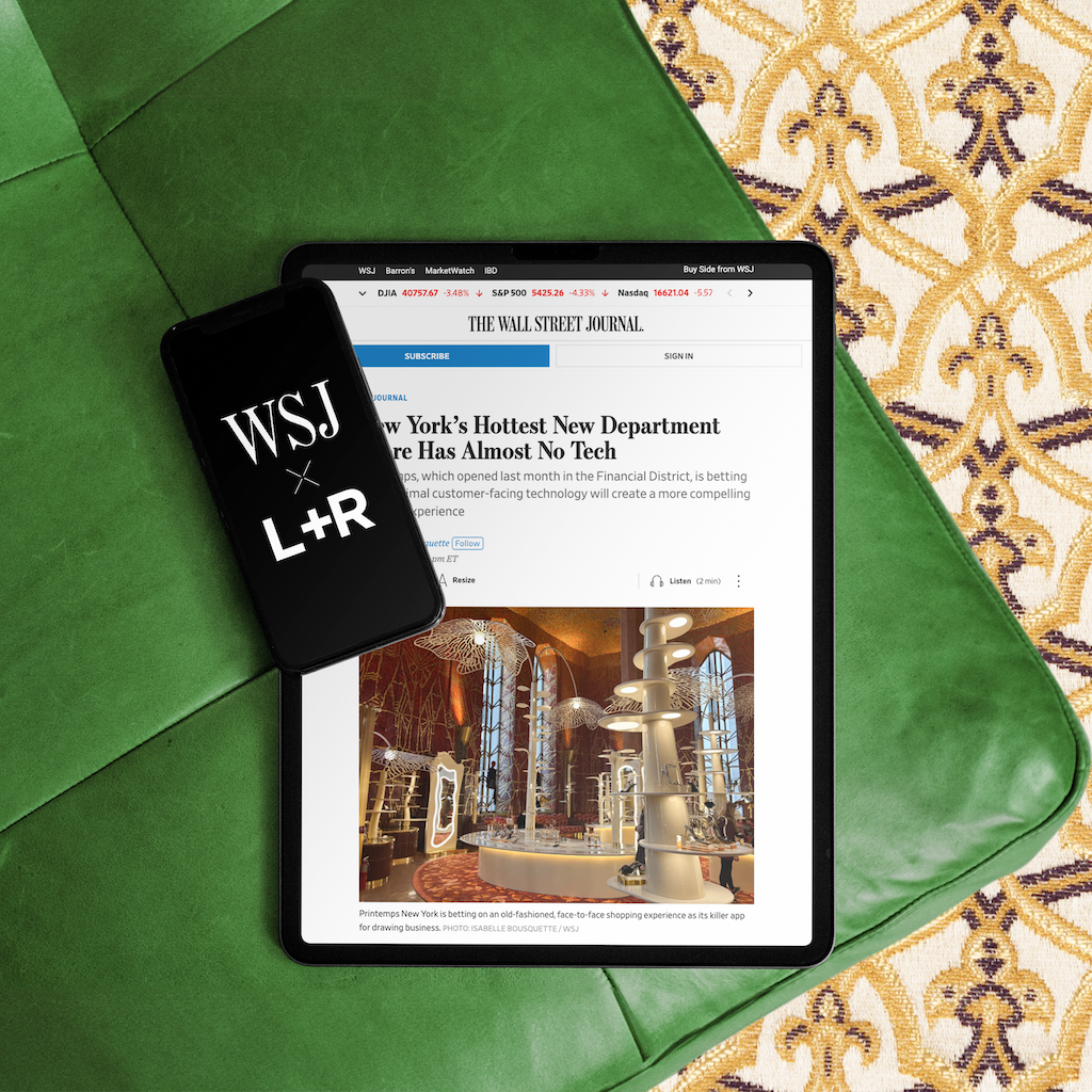 Tablet showing a Wall Street Journal article on Printemps New York beside a phone with the WSJ and L+R marks