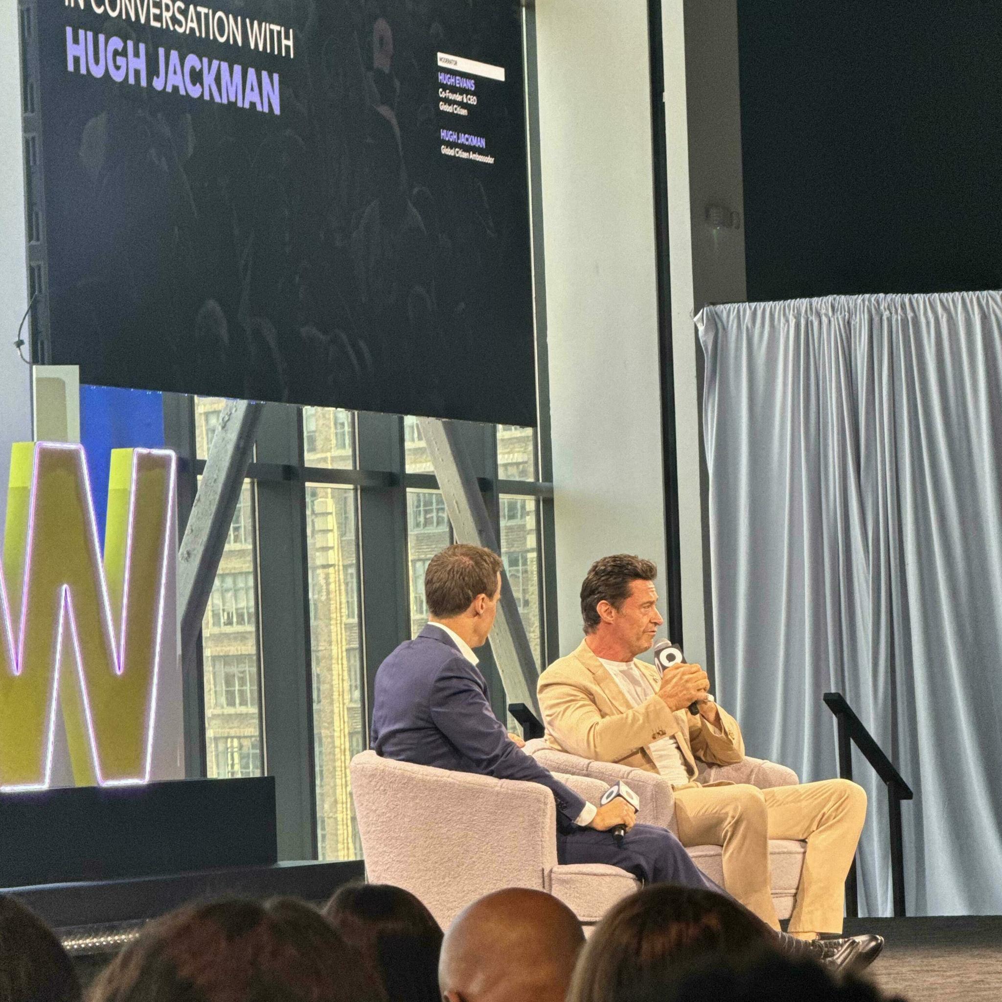 Hugh Evans and Hugh Jackman in conversation on stage at Global Citizen NOW