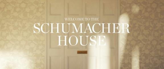 Schumacher House D Cover Wide view of paneled doors with text reading Welcome to the Schumacher House