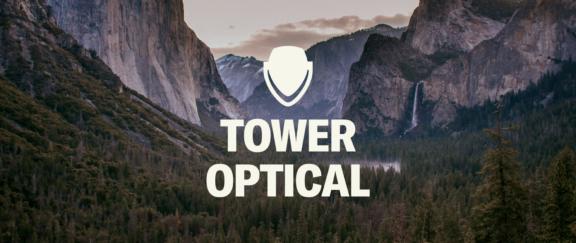 Tower Optical Desktop Cover Tower Optical logo over a mountain valley landscape.