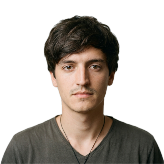 Generated Image January 14 2026 9 20 AM Background Removed Headshot of a young man with brown hair wearing a gray V-neck shirt