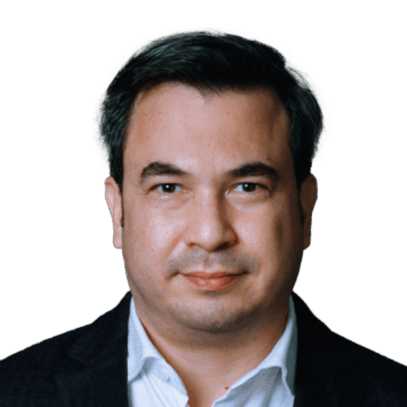 Ivan min Head-and-shoulders portrait of a man in a dark blazer and white shirt on a green background