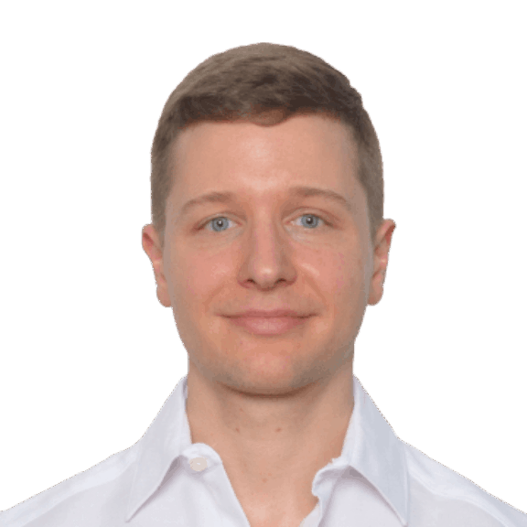 Ryan min Head-and-shoulders portrait of a man in a white collared shirt on a green background