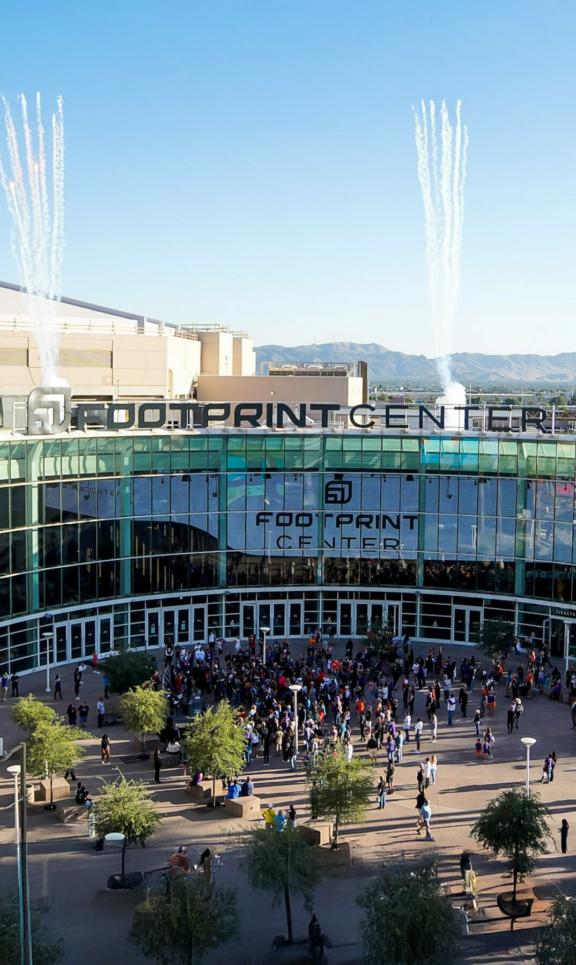 Footprint M Cover Footprint Center arena entrance with crowds outside and Valley Proud banners