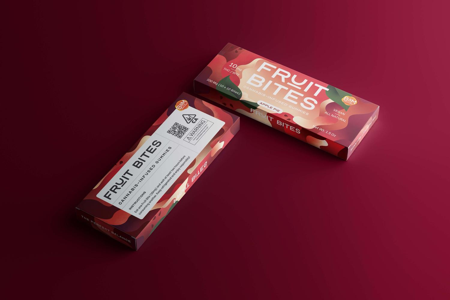 Two Fruit Bites apple pie cannabis gummy boxes on a burgundy background
