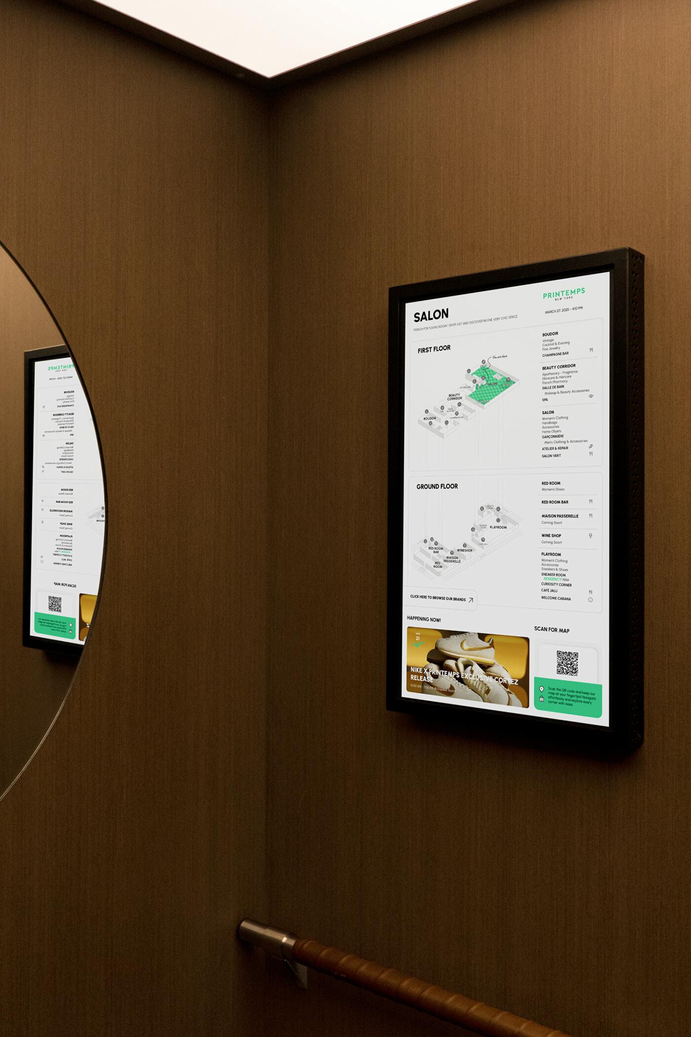 Digital Salon wayfinding map mounted on a wood wall beside a round mirror.