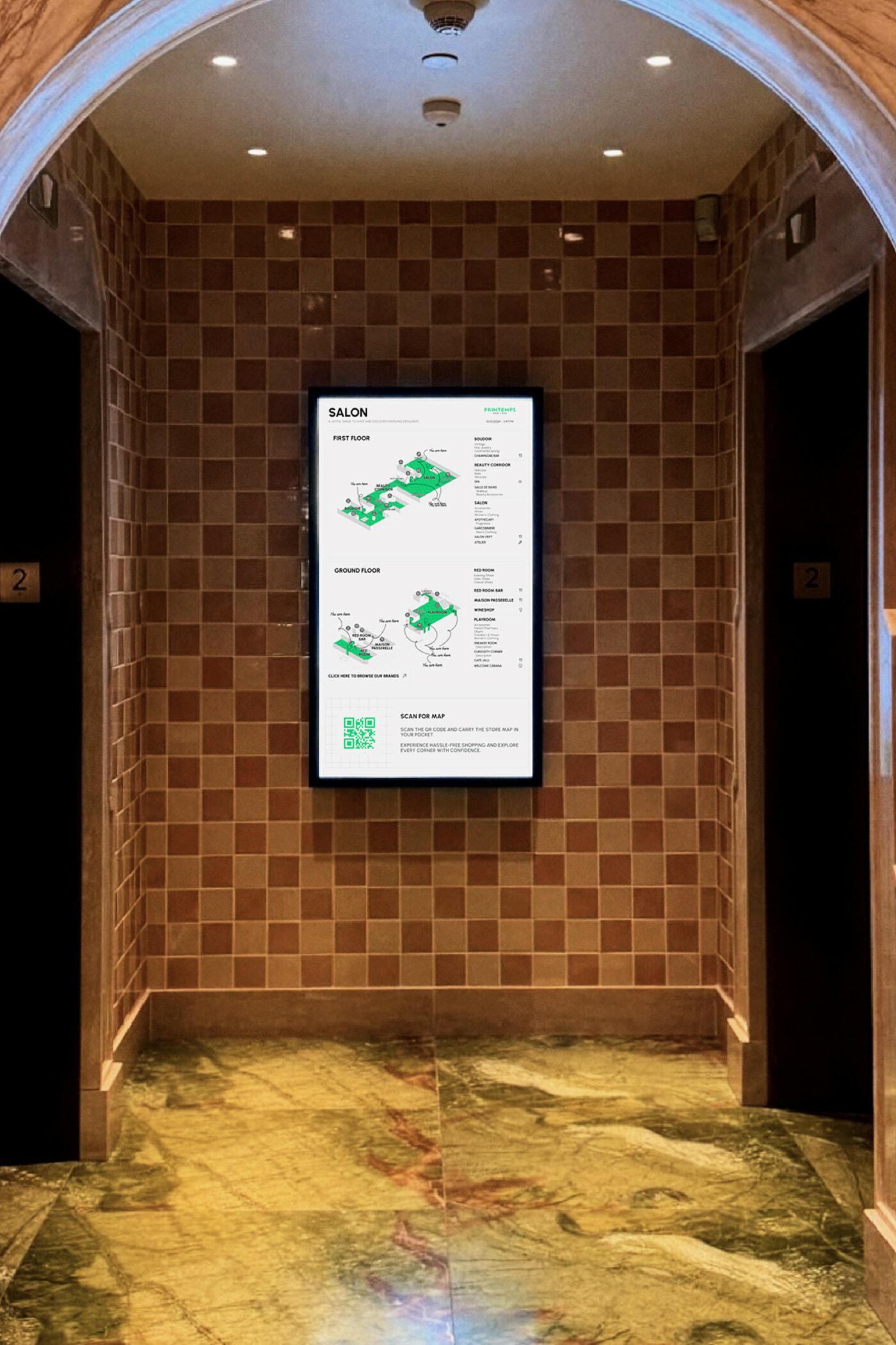 Digital Salon wayfinding map mounted between elevator doors in a tiled hallway.