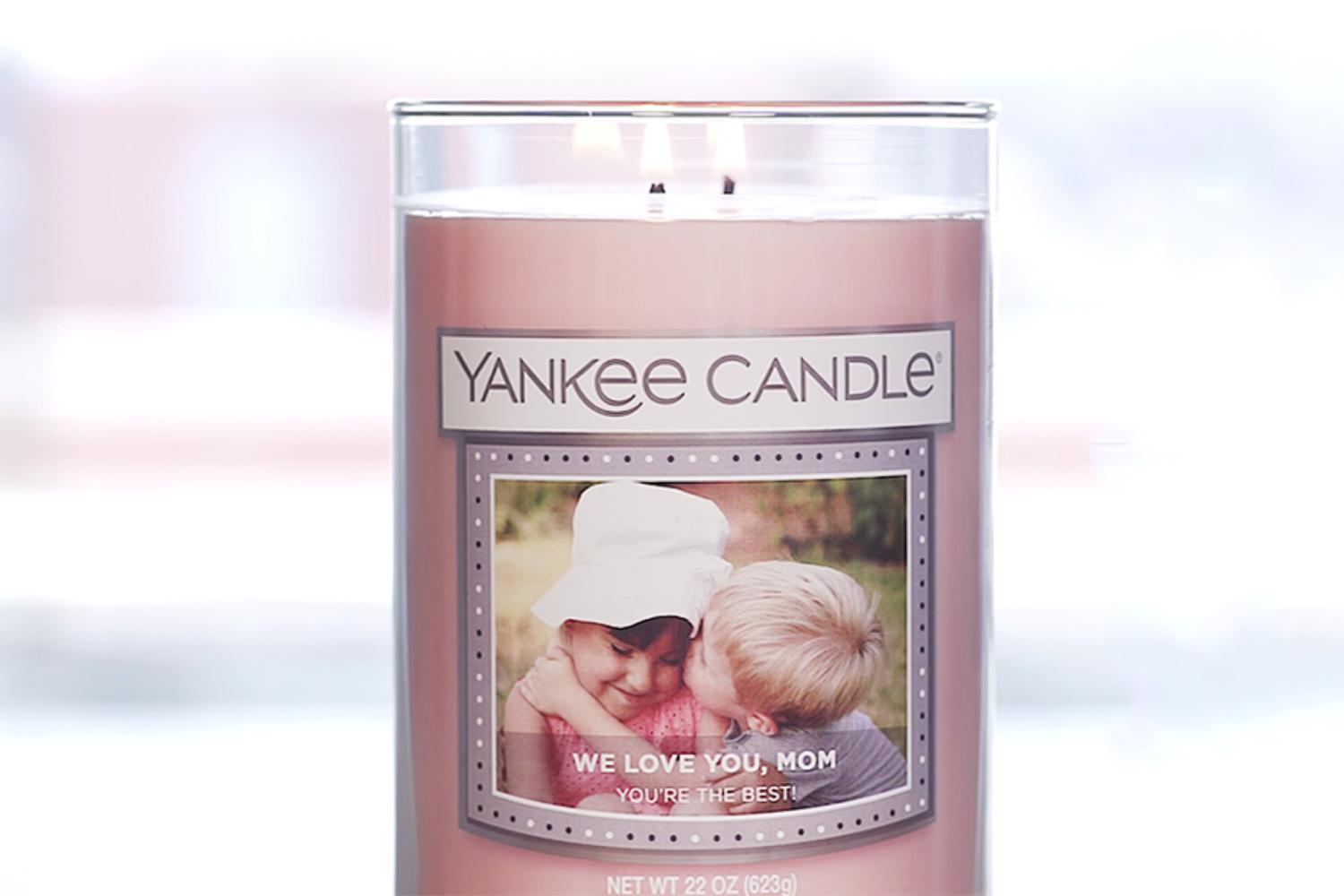 Personalised Yankee Candle jar with a photo label reading "We love you, Mom"