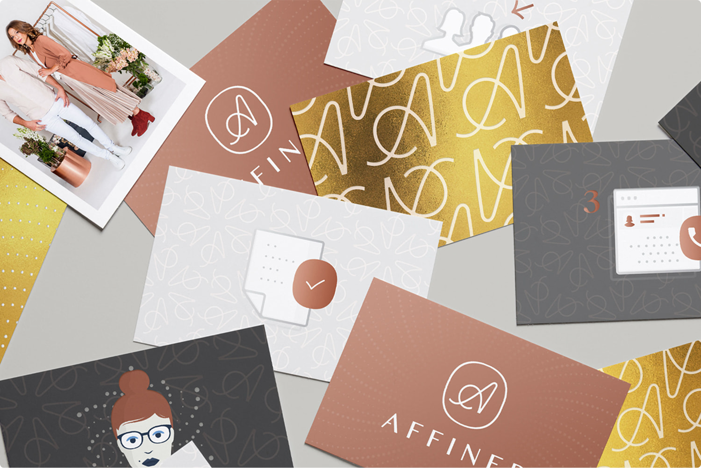 Affiner branded stationery and pattern cards arranged on a grey surface