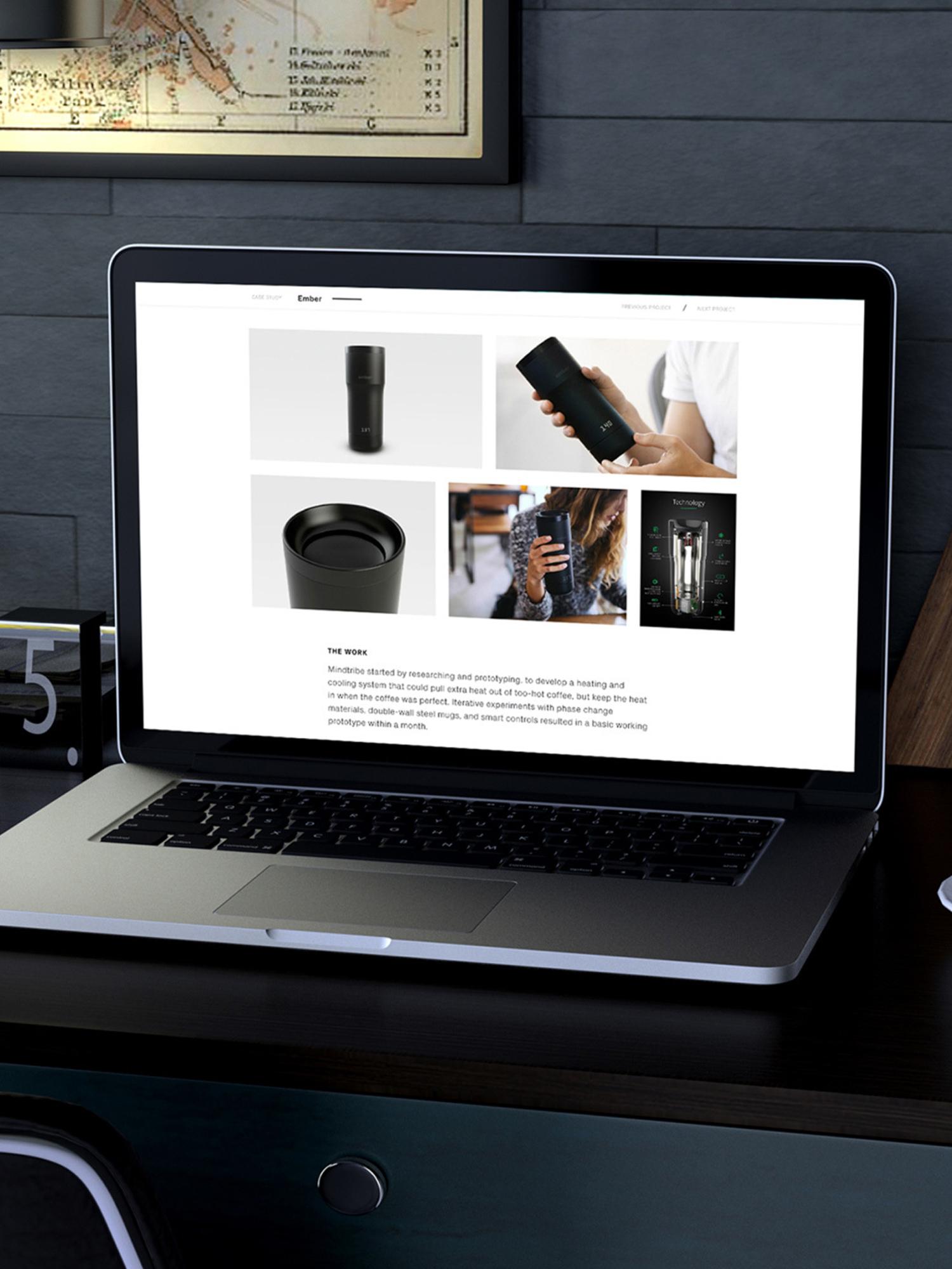 Laptop on a desk showing the Mindtribe case study page for the Ember mug