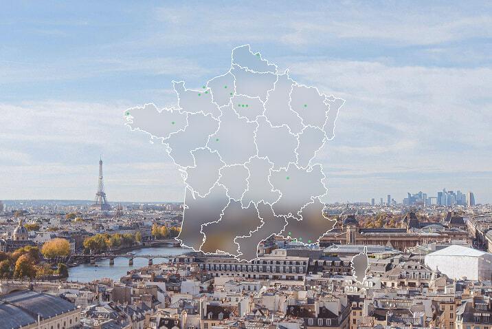 Map of France with green location markers over a Paris skyline.