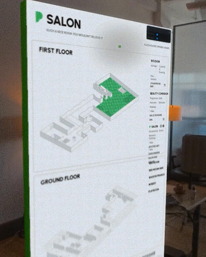 Close-up of a floating Salon wayfinding map in an office setting.