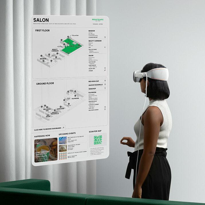 Person wearing a mixed reality headset beside a floating Salon wayfinding map.