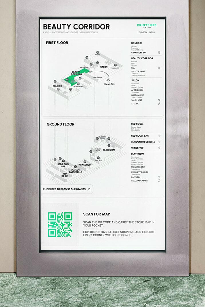 Digital Beauty Corridor wayfinding map with floor plans and a QR code on a wall-mounted screen.