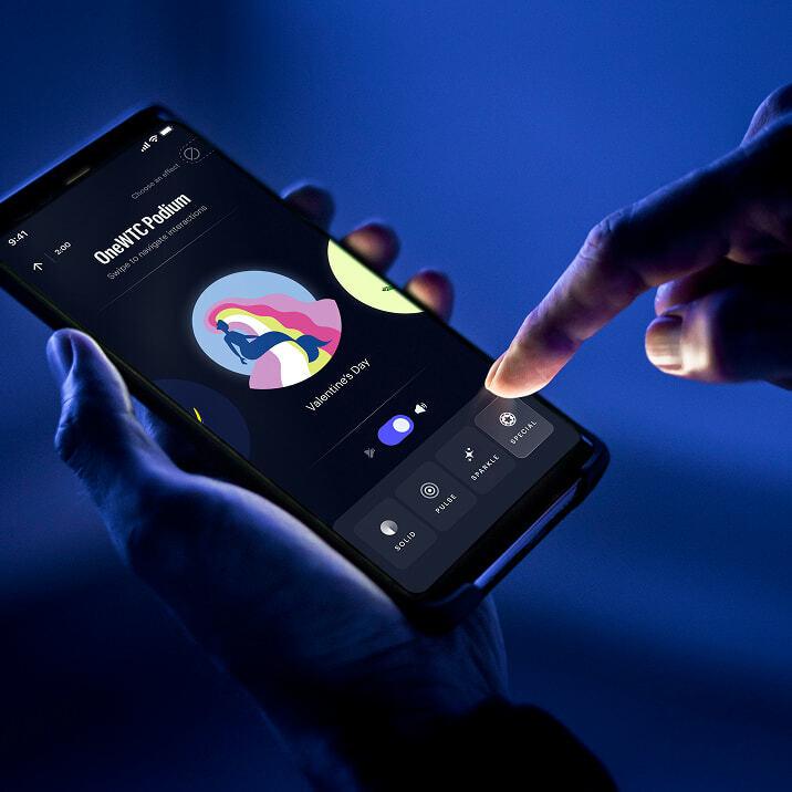 Hand tapping a phone app to pick a Valentine's Day effect for the OneWTC Podium