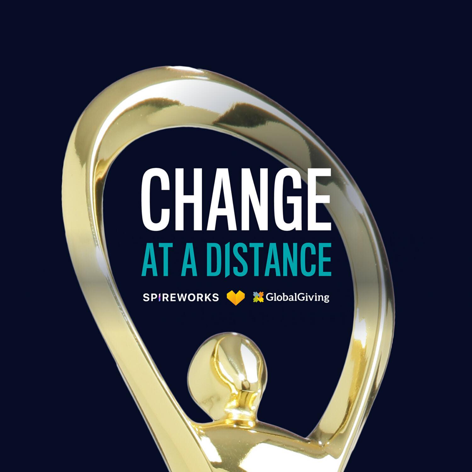 Gold award statuette framing the Change at a Distance lockup with Spireworks and GlobalGiving logos