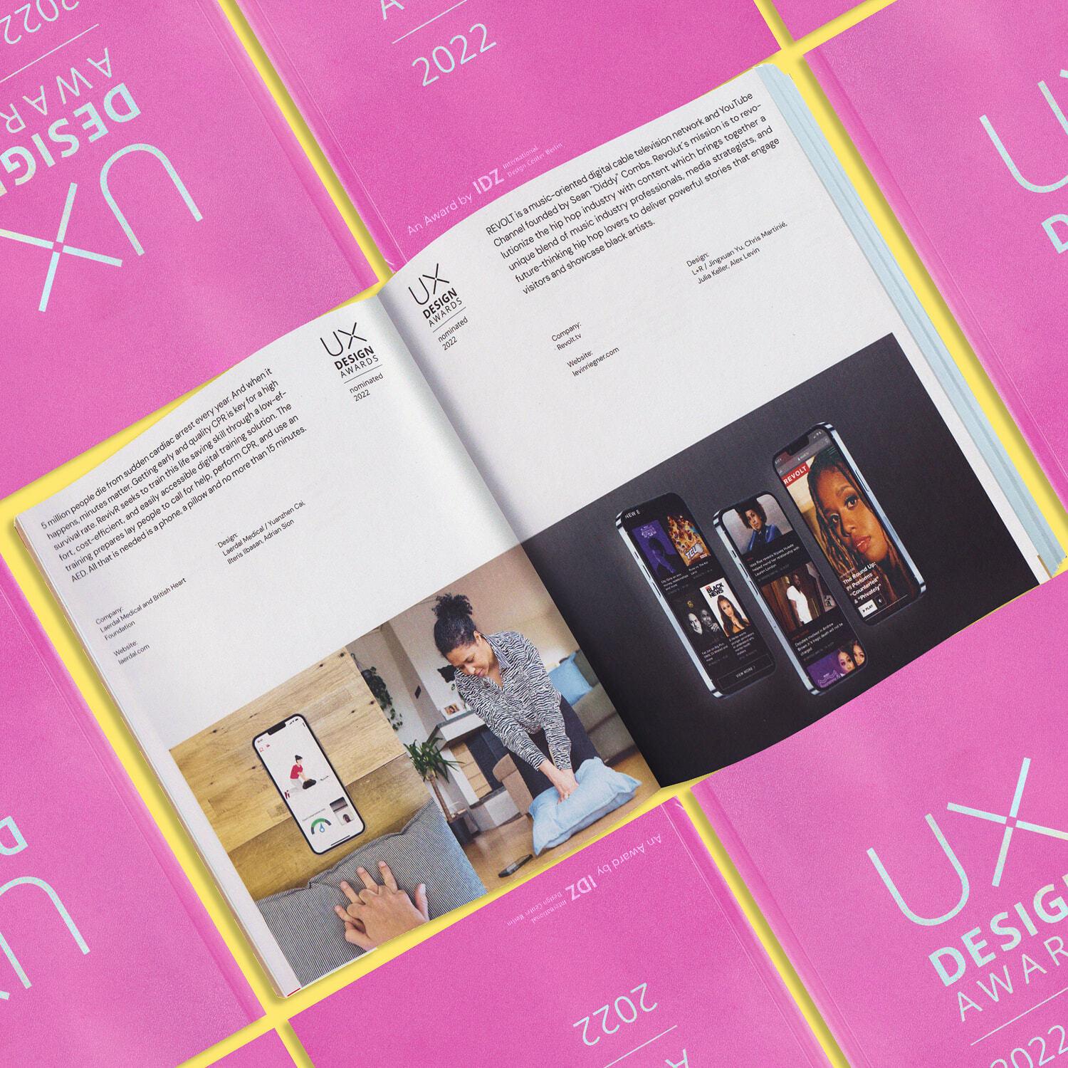 Open UX Design Awards 2022 book spread on pink award books