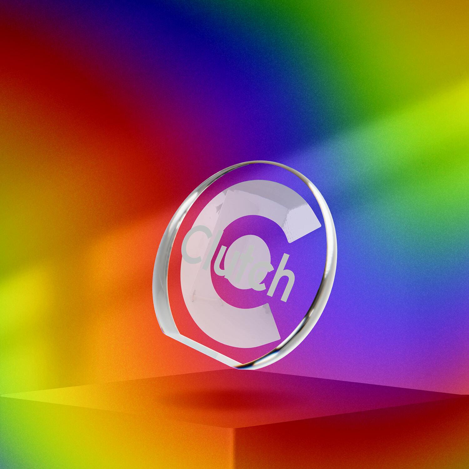 Clutch glass award on a rainbow gradient background