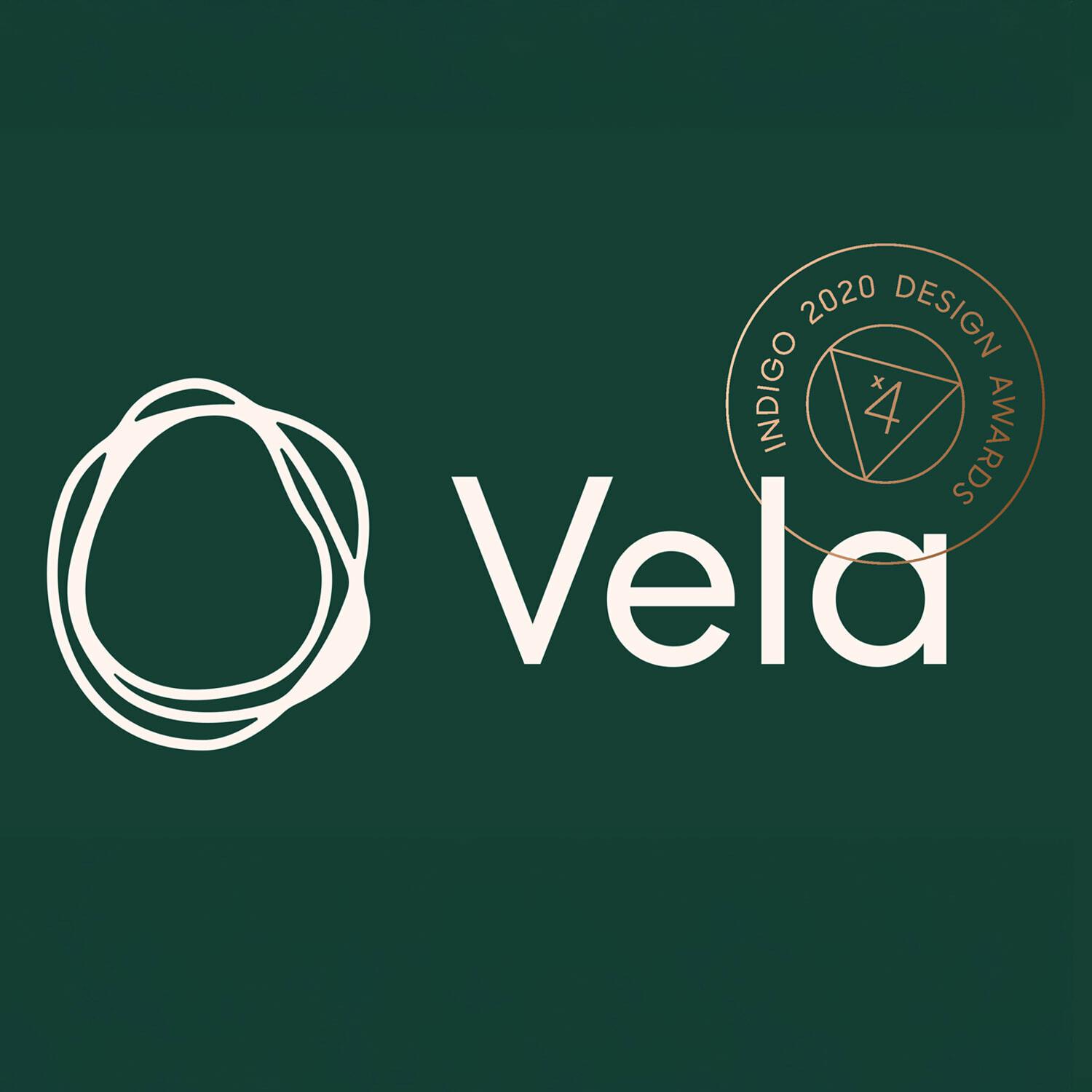 Vela logo with Indigo 2020 Design Awards seal on green background