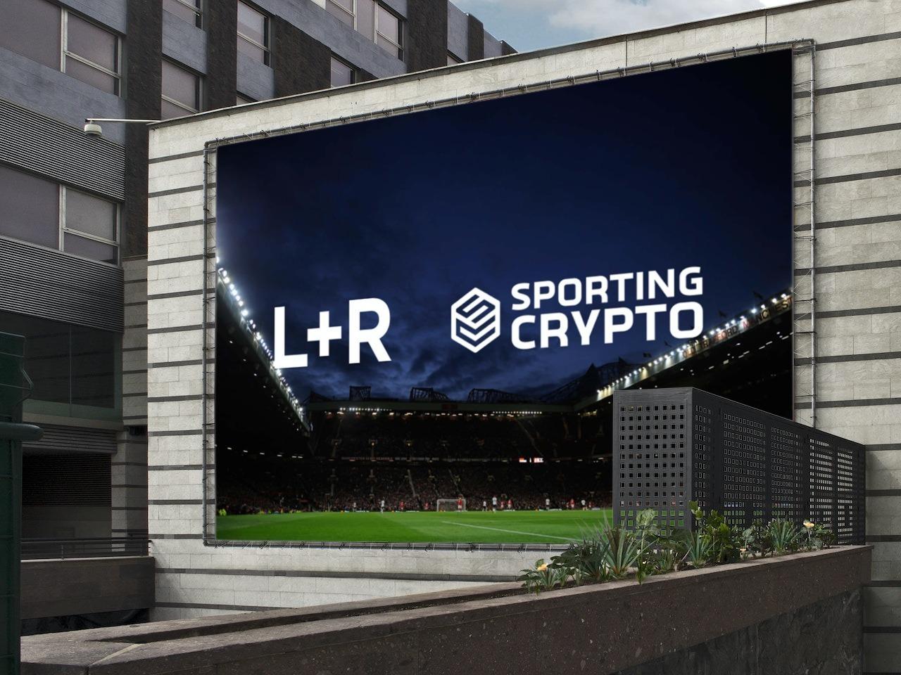 Billboard showing L+R and Sporting Crypto logos over a nighttime stadium scene